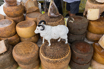 Image showing Various traditional Italian cheese on a market stand