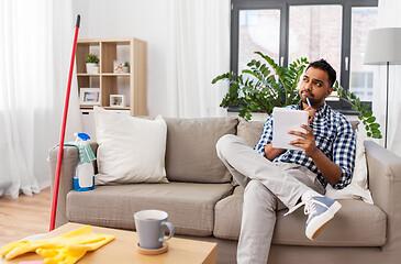 Image showing indian man with to do list after home cleaning