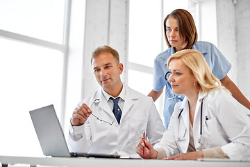 Image showing group of doctors with laptop computer at hospital