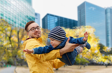 Image showing father with son having fun in autumn tokyo city