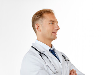 Image showing smiling doctor in white coat at medical office