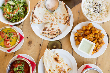 Image showing various food on table of indian restaurant