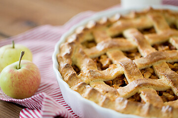 Image showing apple pie in baking mold on wooden table