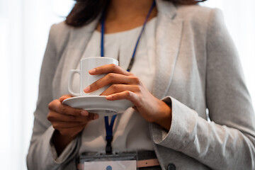 Image showing close up of businesswoman drinking coffee