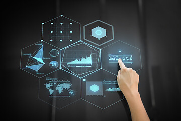 Image showing hand using black interactive panel with charts