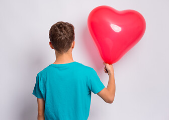 Image showing Boy with heart shaped balloon