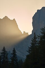 Image showing Sunrise between mountain cliffs