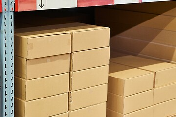 Image showing Warehouse stocked with boxes in stacks