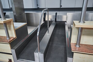 Image showing Check-in counter and baggage conveyor at an airport