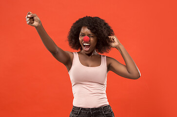 Image showing Happy african woman on red nose day.