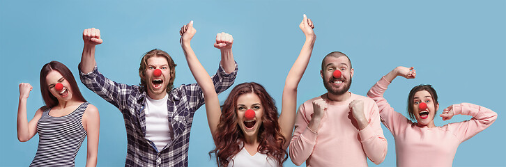 Image showing The collage of faces of surprised people on coral backgrounds.