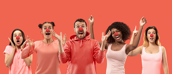 Image showing The collage of faces of surprised people on coral backgrounds.