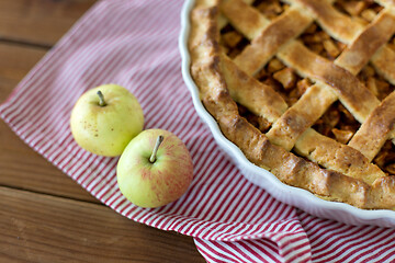 Image showing apple pie in baking mold on wooden table