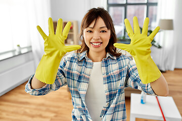 Image showing asian woman with protective rubber gloves on