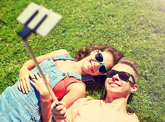 Image showing happy couple taking selfie on smartphone at summer