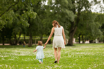 Image showing mother with baby daughter walking at summer park