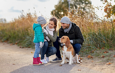 Image showing happy family with beagle dog outdoors in autumn