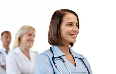 Image showing smiling female doctor or nurse in uniform