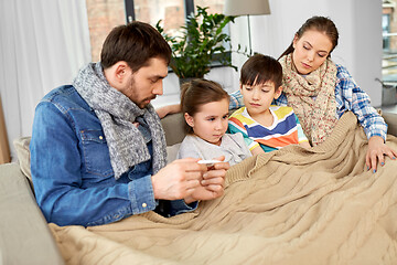 Image showing family with ill children having fever at home