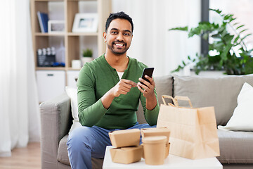 Image showing indian man using smartphone for food delivery