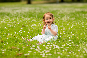 Image showing happy little baby girl at park in summer