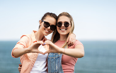 Image showing teenage girls or best friends at seaside in summer