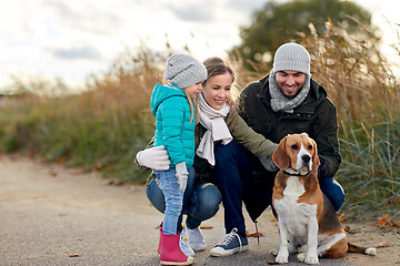 Image showing happy family with beagle dog outdoors in autumn