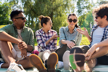 Image showing friends hanging out and talking outdoors in summer