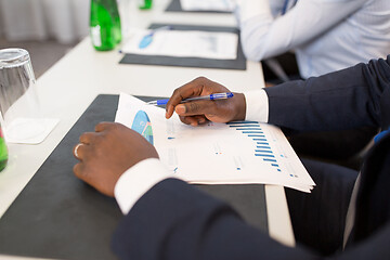 Image showing businessman with charts at conference