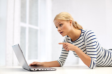 Image showing woman having video call on laptop computer at home