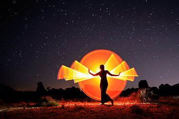 Image showing Person Light Painted in the Desert Under the Night Sky