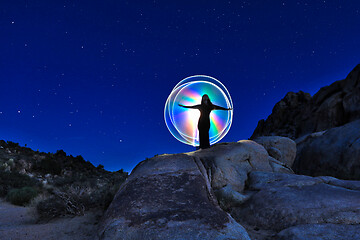 Image showing Person Light Painted in the Desert Under the Night Sky