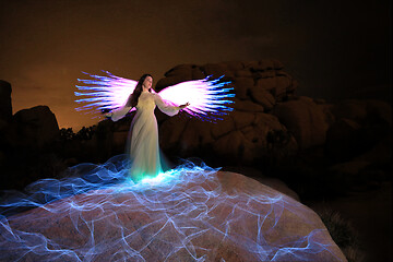 Image showing Person Light Painted in the Desert Under the Night Sky