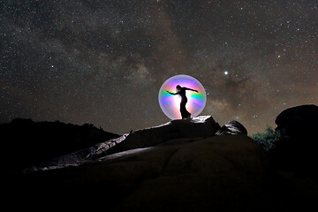 Image showing Person Light Painted in the Desert Under the Night Sky