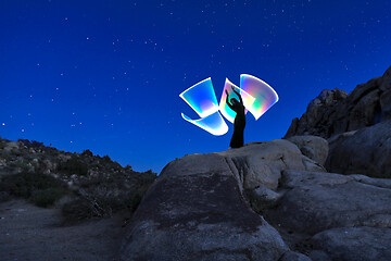 Image showing Person Light Painted in the Desert Under the Night Sky