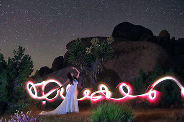 Image showing Person Light Painted in the Desert Under the Night Sky