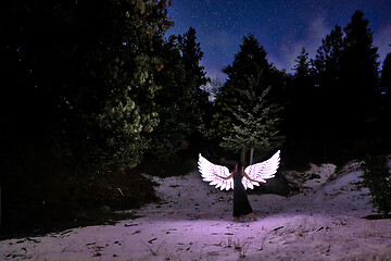 Image showing Person Light Painted in the Desert Under the Night Sky