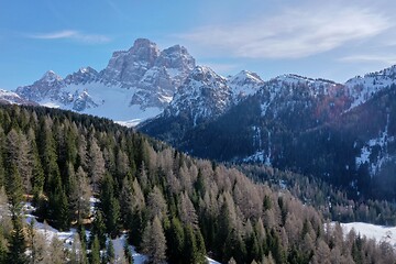 Image showing aerial snow covered mountain peaks in alps at winter 