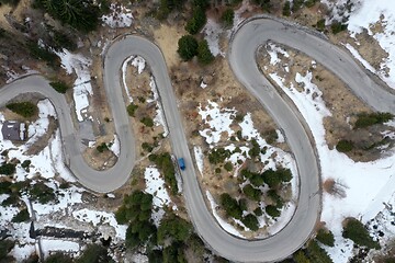 Image showing alpine curvy road on winter top view