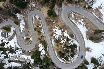 Image showing alpine curvy road on winter top view