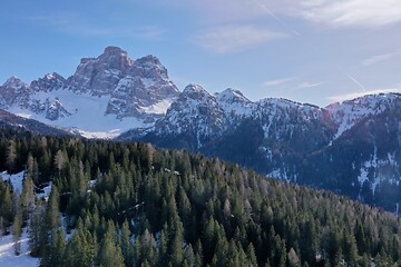 Image showing aerial snow covered mountain peaks in alps at winter 