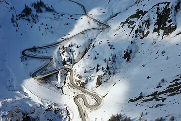 Image showing aerial snow covered mountain peaks in alps at winter 