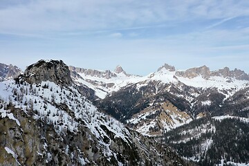 Image showing aerial snow covered mountain peaks in alps at winter 