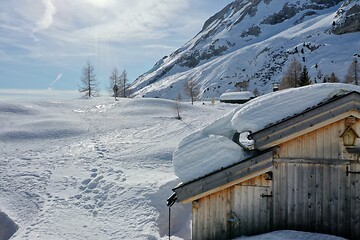 Image showing aerial snow covered mountain peaks in alps at winter 