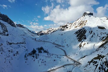 Image showing aerial snow covered mountain peaks in alps at winter 