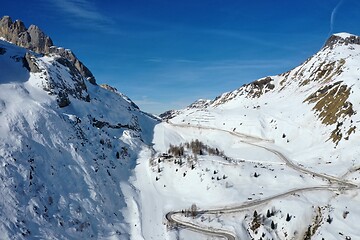 Image showing aerial snow covered mountain peaks in alps at winter 