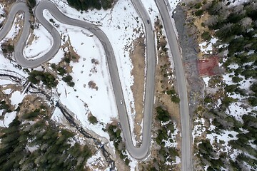 Image showing alpine curvy road on winter top view