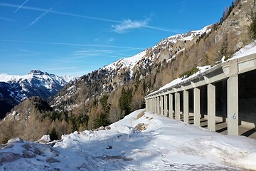 Image showing aerial snow covered mountain peaks in alps at winter 