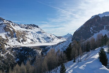 Image showing aerial snow covered mountain peaks in alps at winter 