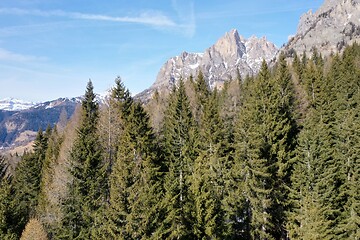 Image showing aerial snow covered mountain peaks in alps at winter 